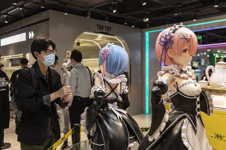 A guest looks at a display of anime characters during the opening of Miniso Group Holding Ltd.'s Toptoy flagship store in Shanghai, China, on 28 April 2021. (Qilai Shen/Bloomberg)
