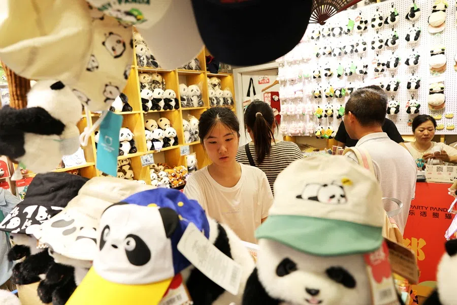 People shop panda stuff toys at a store ahead of the World Games Chengdu 2025, on 6 August 2025.