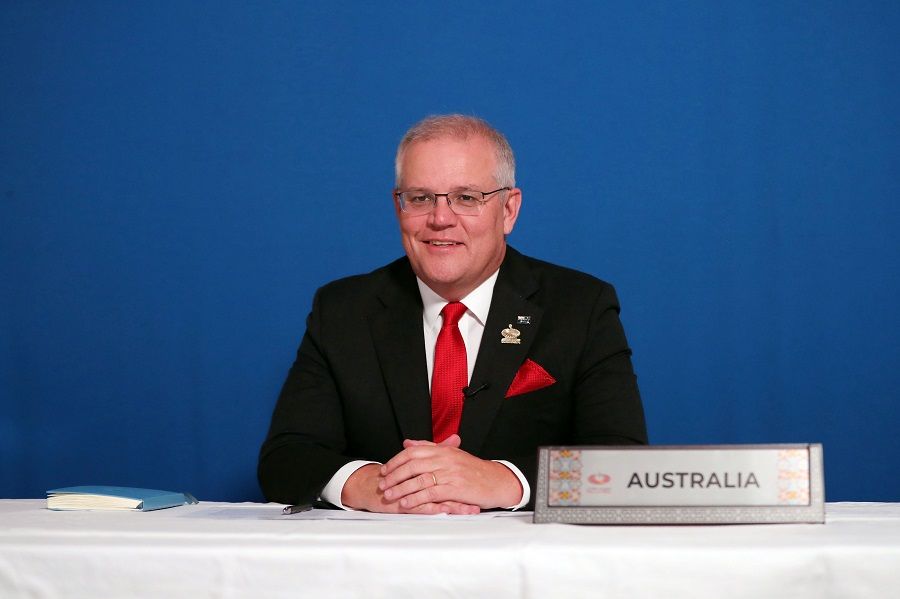 This handout picture taken on 21 November 2020 and released by the Australian Prime Minister's Office shows Australia's Prime Minister Scott Morrison attending an online session of the 2020 Malaysian APEC summit from Canberra along with other APEC leaders from around the world on 21 November 2020. (Adam Taylor/Prime Minister Office Australia/AFP)