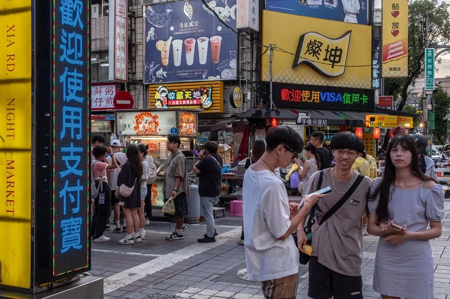Shoppers at a night market in Taipei, Taiwan, on 8 July 2024. (Lam Yik Fei/Bloomberg)