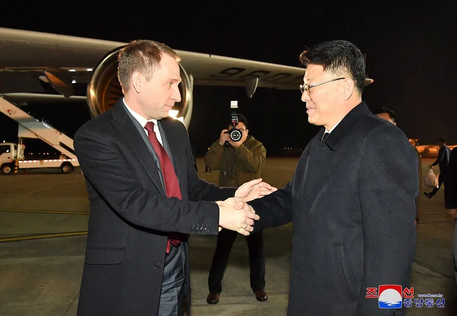 This picture taken on 20 November 2024 and released from North Korea’s official Korean Central News Agency (KCNA) via KNS on 21 November 2024 shows Russia’s Minister of Natural Resources and Ecology Alexander Kozlov (left) being seen off by North Korea’s External Economic Relations Minister Yun Jong-ho (right) as he departs from Pyongyang International Airport in Pyongyang. (KCNA via KNS/AFP)