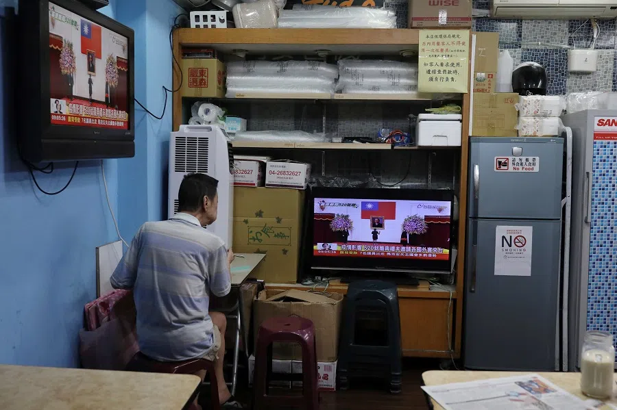 A man watches the live inauguration ceremony of Taiwan President Tsai Ing-wen in Taipei, Taiwan, on 20 May 2020. (Ann Wang/Reuters)