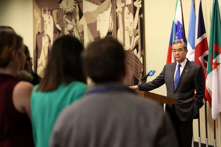 China’s Foreign Minister Wang Yi speaks to the press following a meeting of the United Nations Security Council at the U.N. headquarters in New York City, US, 18 February 2025. (Brendan McDermid/Reuters)