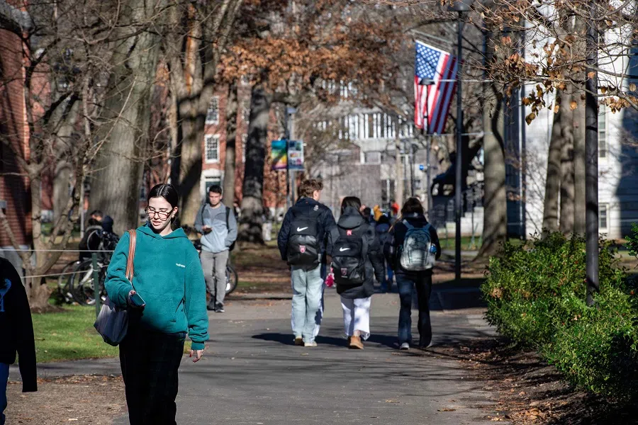 People walk through Harvard Yard at Harvard University in Cambridge, Massachusetts, on 12 December 2023. (Joseph Prezioso/AFP)
