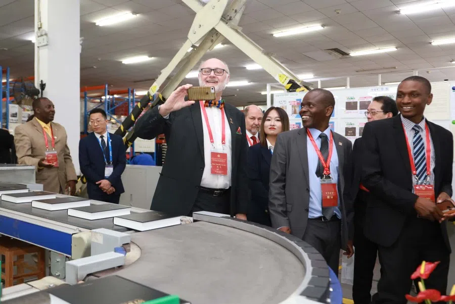 Visitors at APC's printing facility.