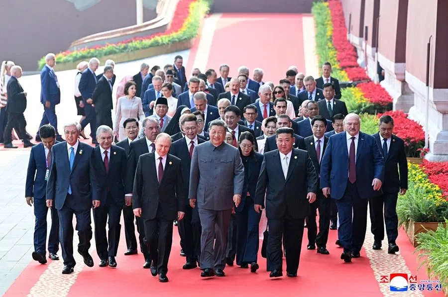 This picture taken on 3 September 2025 and released from North Korea's official Korean Central News Agency on 4 September 2025 shows Russia's President Vladimir Putin, China's President Xi Jinping and North Korean leader Kim Jong Un arriving to a military parade marking the 80th anniversary of victory over Japan and the end of World War II, in Beijing’s Tiananmen Square. (KCNA via KNS/AFP)