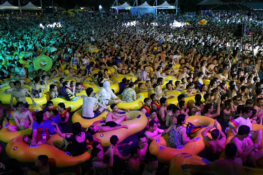 People enjoy a music party inside a swimming pool at the Wuhan Maya Beach Park, in Wuhan, following the Covid-19 coronavirus outbreak, Hubei, China, 15 August 2020. (Stringer/Reuters)