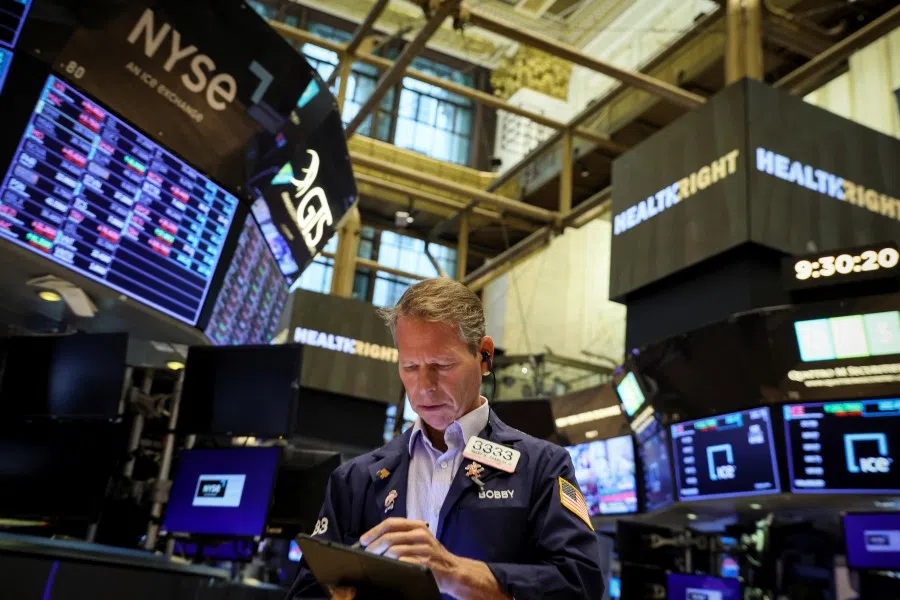 A trader works on the floor of the New York Stock Exchange (NYSE) in New York City, US, 29 August 2022. (Reuters/Brendan McDermid)