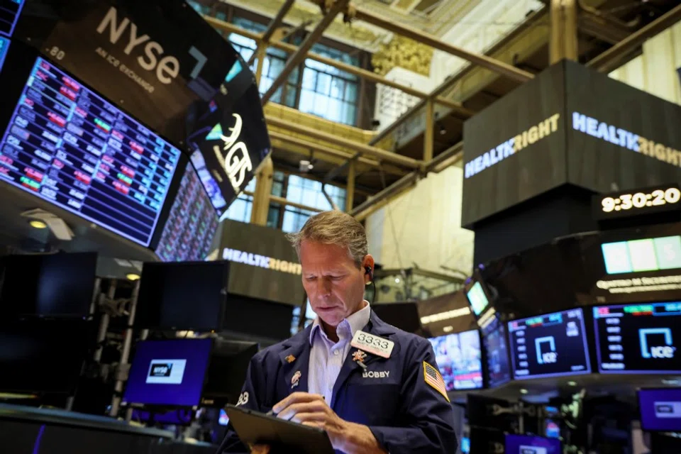 A trader works on the floor of the New York Stock Exchange (NYSE) in New York City, US, 29 August 2022. (Reuters/Brendan McDermid)