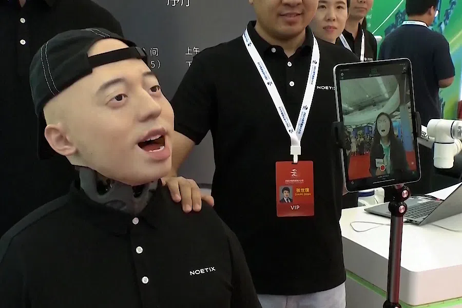 A humanoid by Noetix mimics human facial expressions in real-time at the 2024 World Robot Conference in Beijing, China, on 21 August 2024.