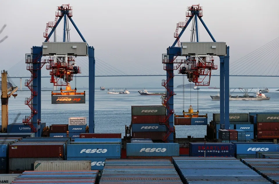 Shipping containers are seen at a commercial port in Vladivostok, Russia, 15 February 2023. (Tatiana Meel/Reuters)