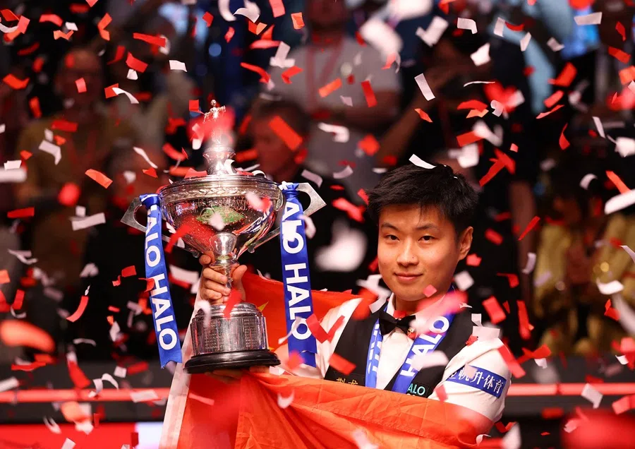 China’s Zhao Xintong celebrates with his trophy, on 5 May 2025. (Andrew Boyers/Action Images via Reuters)