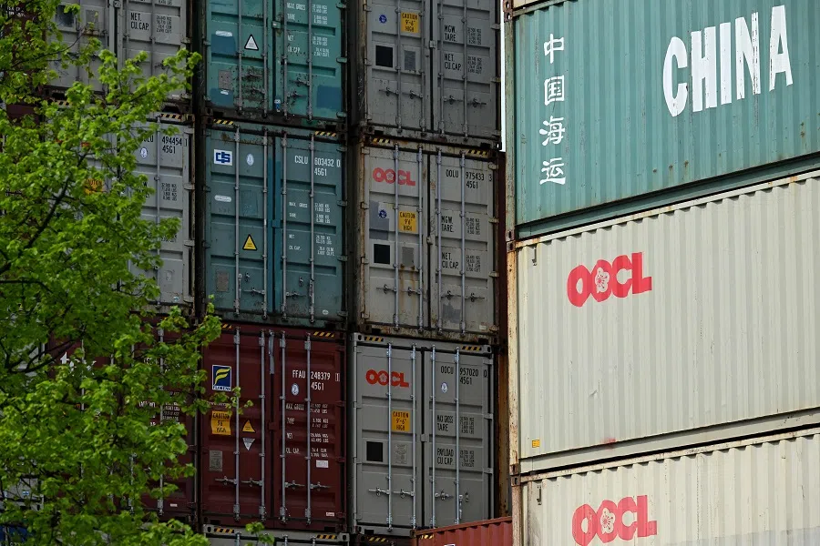 Containers of China Shipping and OOCL shipping companies are stacked at a transshipment station in Frankfurt am Main, Germany, on 15 April 2025. (Kirill Kudryavtsev/AFP)
