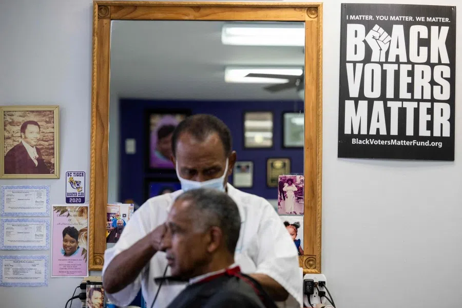 A man gets his hair trimmed in Charleston, South Carolina, on 2 February 2024. (Jim Watson/AFP)