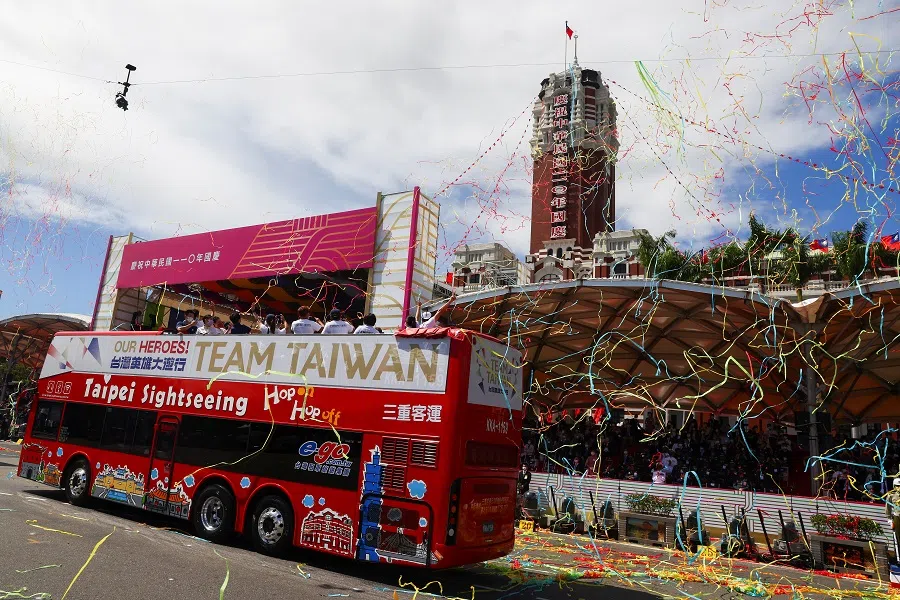 People take pictures during the Double Tenth Day celebration in Taipei, Taiwan, 10 October 2021. (Ann Wang/Reuters)