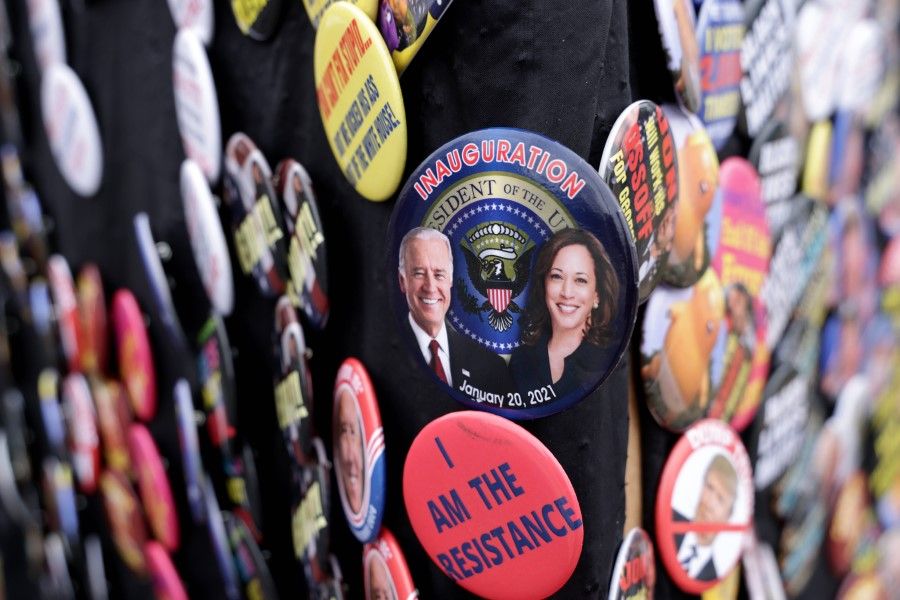 A button featuring President-elect Joe Biden and Vice President-elect Kamala Harris' inauguration is on display by a street vendor in Eatonton, Georgia, 2 January 2021. (Alex Wong/AFP)