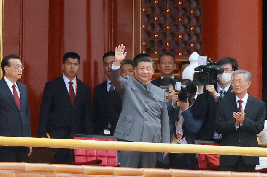 Chinese President Xi Jinping waves at the end of the event marking the 100th founding anniversary of the Communist Party of China, on Tiananmen Square in Beijing, China, 1 July 2021. (Carlos Garcia Rawlins/Reuters)