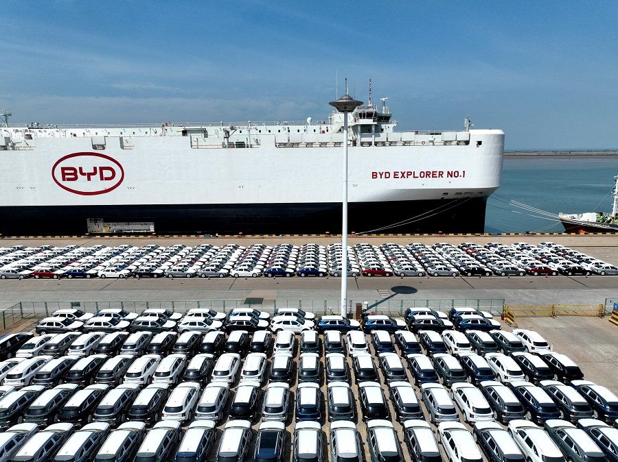 A drone view shows BYD electric vehicles before being loaded onto the “BYD Explorer No.1” roll-on, roll-off vehicle carrier for export to Brazil, at the port of Lianyungang in Jiangsu province, China, on 25 April 2024.  (China Daily via Reuters)