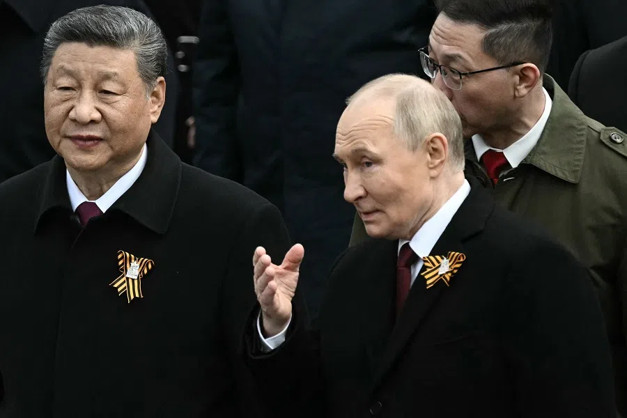Russian President Vladimir Putin and Chinese President Xi Jinping attend a ceremony to lay flowers at the Tomb of the Unknown Soldier by the Kremlin wall in central Moscow on 9 May 2025. (Angelos Tzortzinis/AFP)