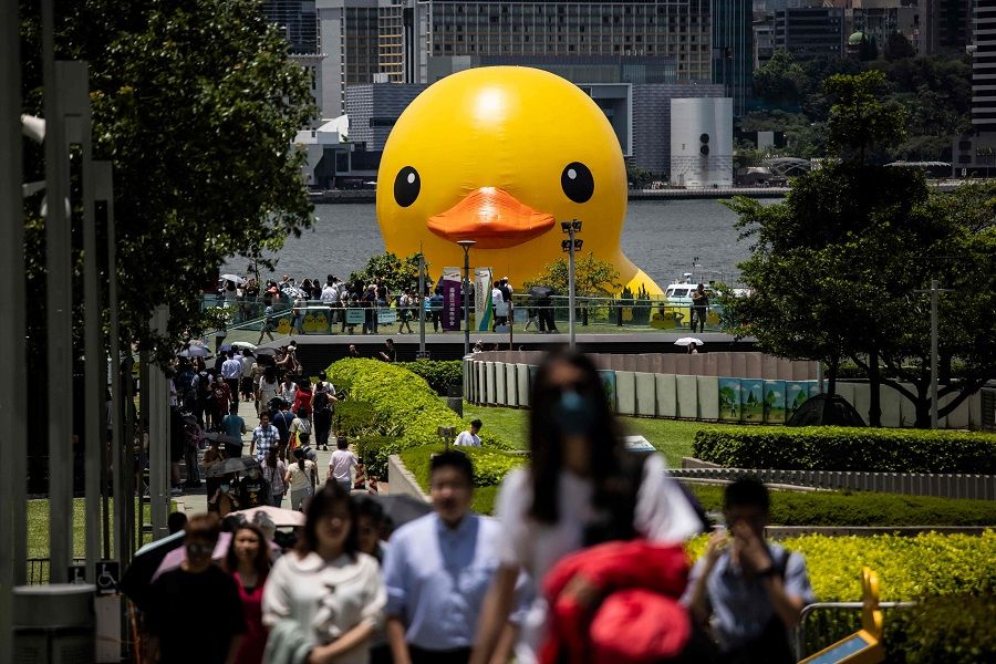 One of two large inflatable yellow ducks named "Double Ducks" by Dutch artist Florentijn Hofman is seen at Victoria Harbour in Hong Kong, China on 12 June 2023. (Isaac Lawrence/AFP)