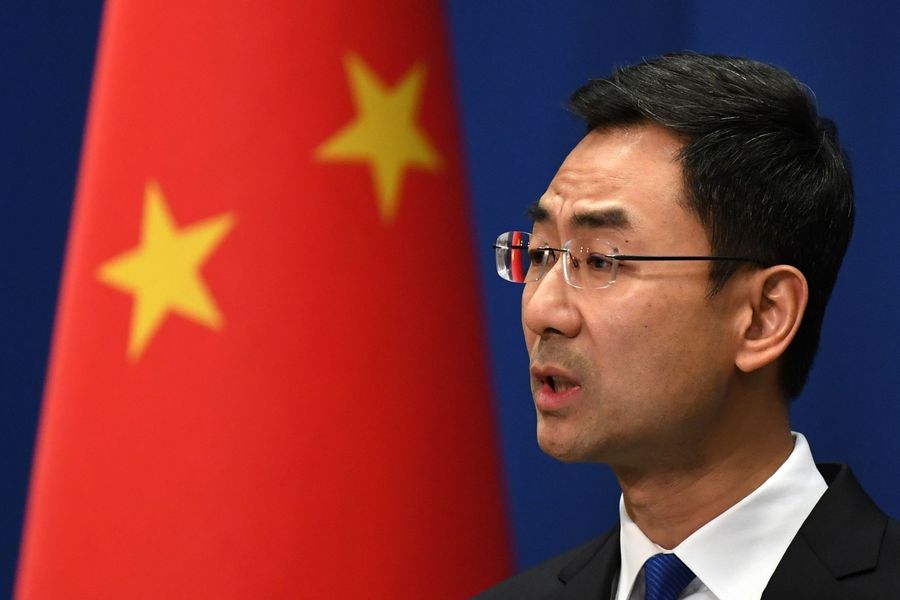 Chinese foreign ministry spokesperson Geng Shuang speaks during the daily press briefing in Beijing on 18 March 2020. He showcased China's "results slip" on 17 March, citing China's continuous efforts in providing medical resources to other countries. (Greg Baker/AFP)