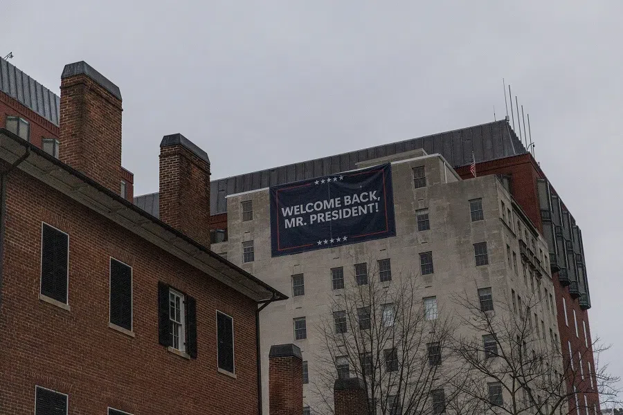 A sign which reads “Welcome Back Mr. President!” is seen near the White House in Washington, DC, US, on 19 January 2025. (Carlos Barria/Reuters)