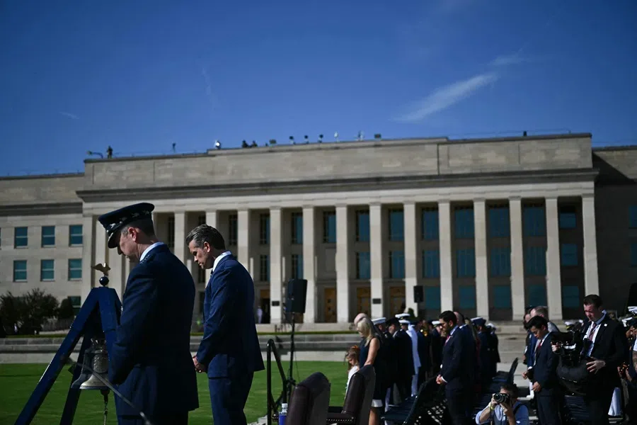 US Defence Secretary Pete Hegseth and US Chairman of the Joint Chiefs of Staff Air Force Gen. Dan Caine (left) bow their heads during the national anthem at the 2026 National POW/MIA Recognition Day Ceremony at the Pentagon in Washington, DC, on 18 September 2026.