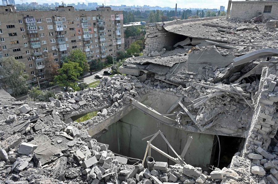A picture shows a roof of a residential building damaged after shelling in Kharkiv, Ukraine, on 21 September 2022, amid Russia's invasion of Ukraine. (Sergey Bobok/AFP)