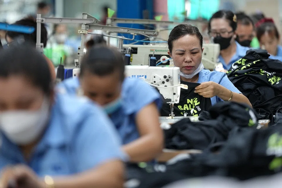 Vietnamese garment factory workers stitch apparel at a factory in Ho Chi Minh City, Vietnam, on 3 April 2025, after US President Donald Trump unveiled sweeping new tariffs on trading partners. (Huu Kha/AFP)