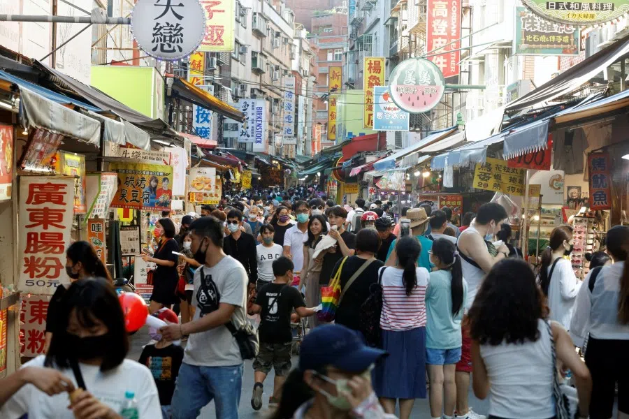 People throng a street in Tamsui district of New Taipei City, Taiwan, 7 August 2022. (Jameson Wu/Reuters)