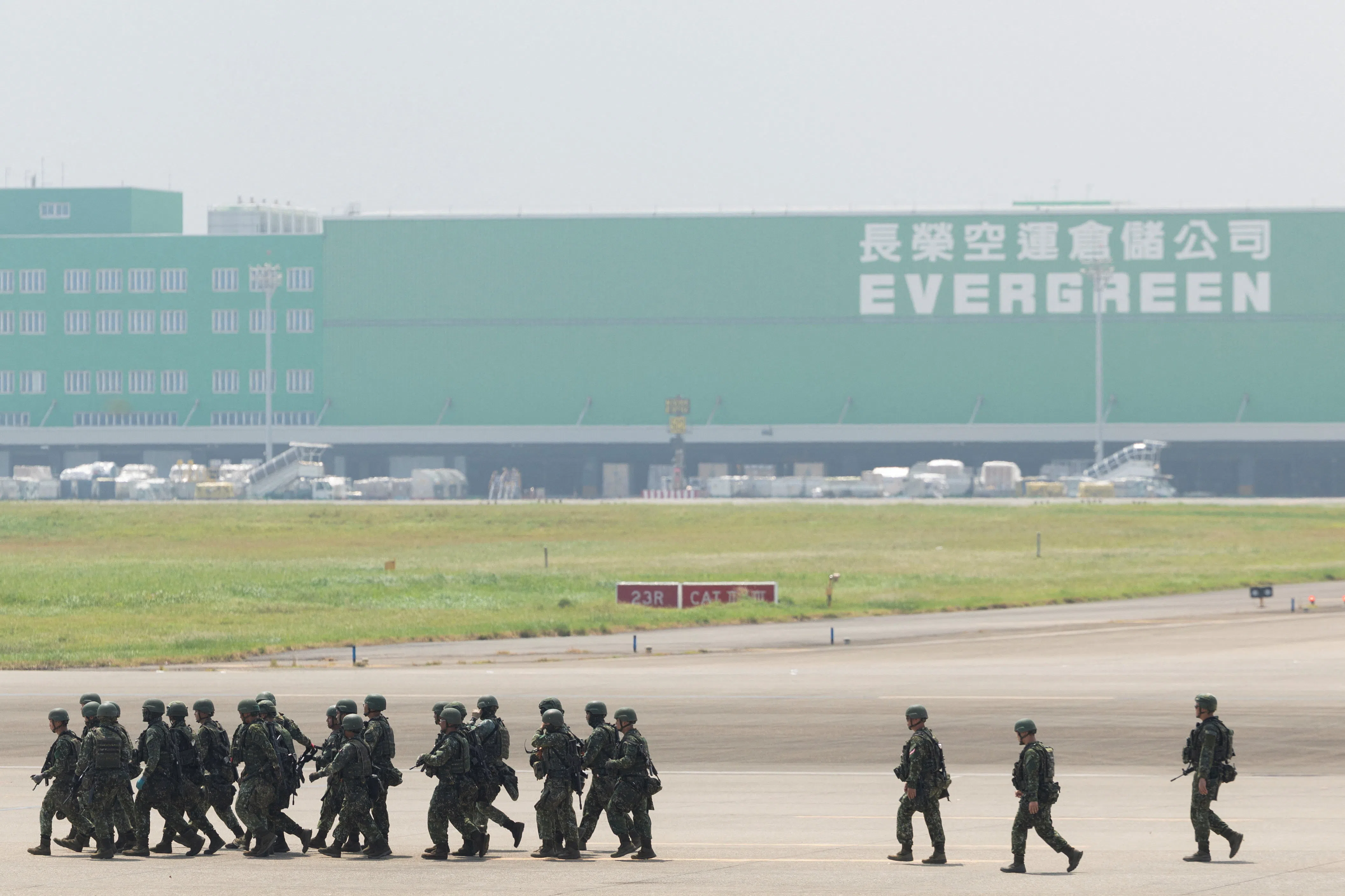 Military personnel walk at Taiwan Taoyuan International Airport during the annual Han Kuang military exercise in Taoyuan, Taiwan, 7 August 2026.