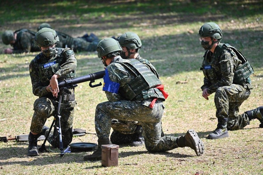 Taiwan's reservists take part in military training at a military base in Taoyuan on 12 March 2022. (Sam Yeh/AFP)
