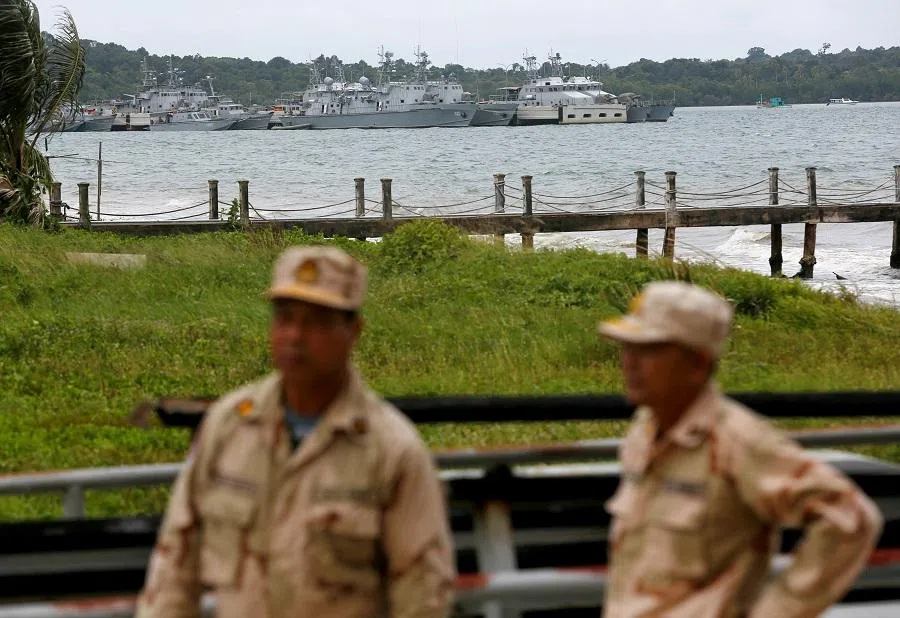 Sailors stand guard at the Cambodian Ream Naval Base in Sihanoukville, Cambodia, on 26 July 2019. (Samrang Pring/Reuters)