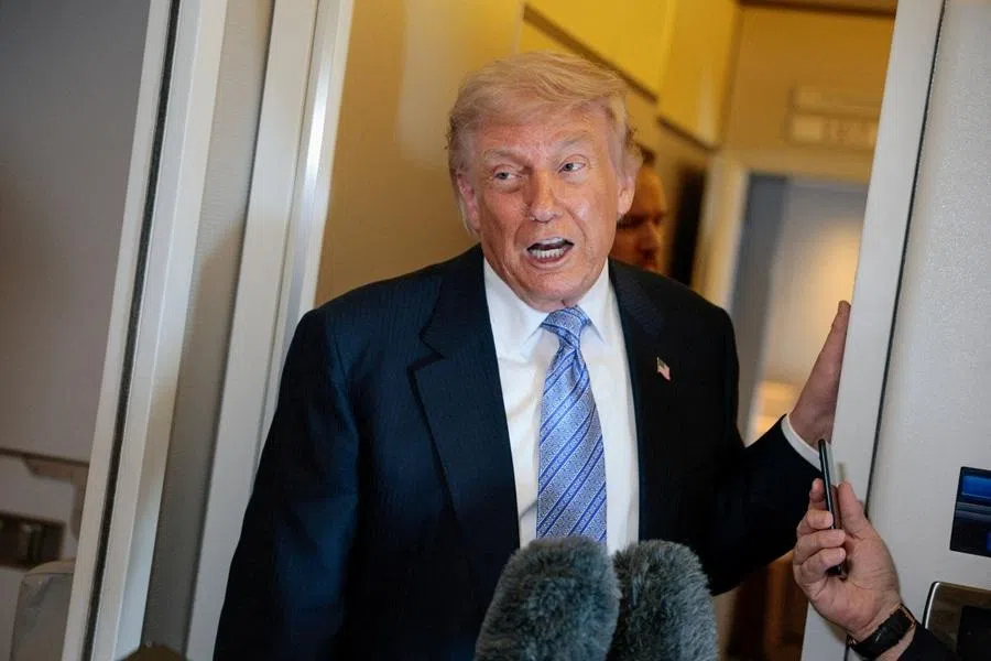 US President Donald Trump speaks to the press aboard Air Force One enroute to the US following his official visit with President Xi Jinping in China, 15 May 2026. (Evan Vucci/Reuters)
