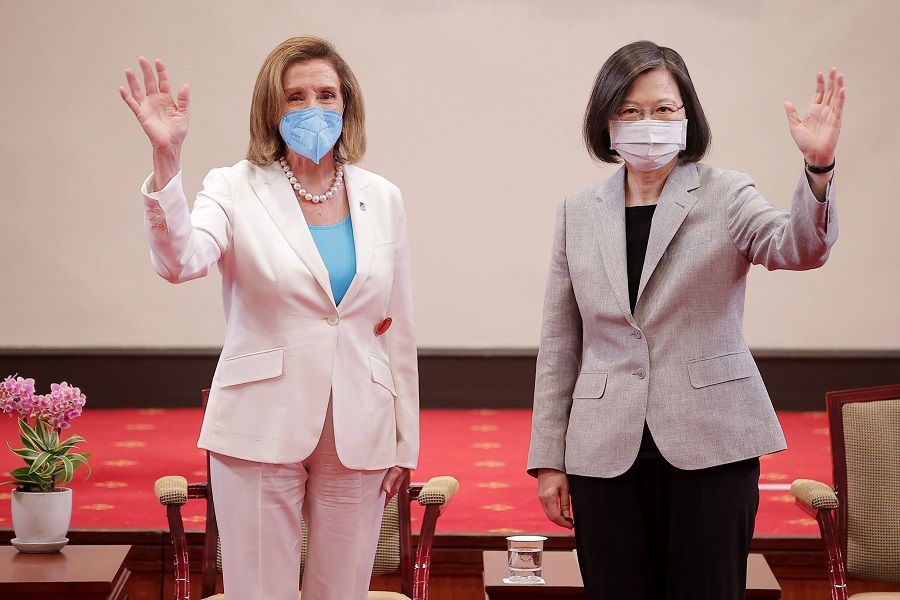 This handout taken and released by Taiwan's Presidential Office on 3 August 2022 shows US House Speaker Nancy Pelosi (left) waving beside Taiwan's President Tsai Ing-wen at the Presidential Office in Taipei. (Handout/Taiwan Presidential Office/AFP)