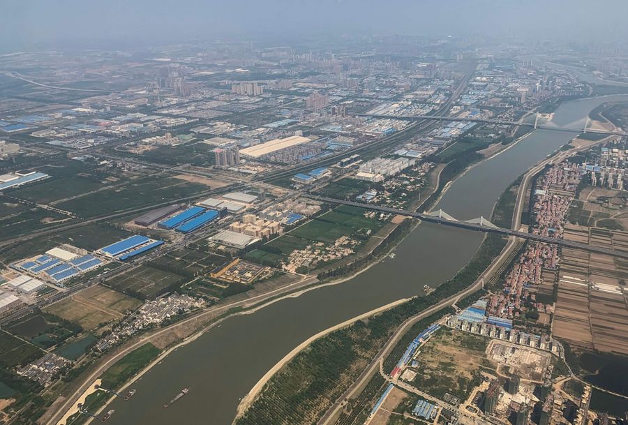 Wuhan, a city gloriously named the "thoroughfare to nine provinces", is the epicentre of the Covid-19 outbreak. This aerial view taken on 6 September 2019 shows the Yangtze River in the city of Wuhan in Hubei Province. (Hector Retamal/AFP)