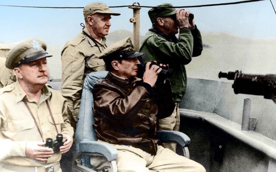 In September 1950, UNC Commander-in-Chief MacArthur (centre, seated) led a landing at Incheon, splitting the North Korean army in two and cutting off their southward attack, leading to the latter's defeat.