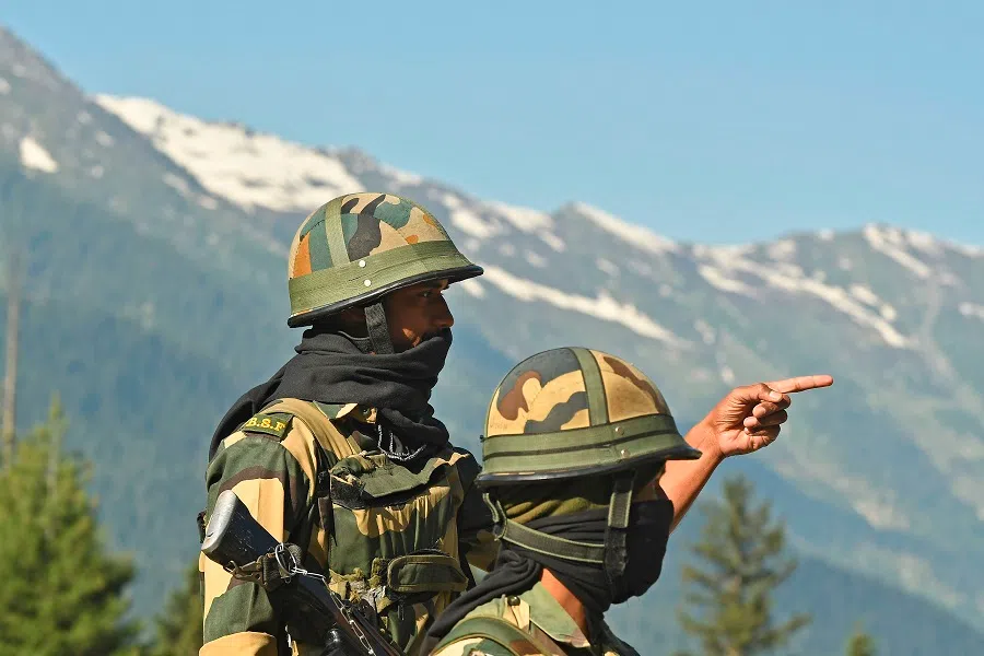 Indian Border Security Force soldiers guard a highway leading towards Leh, bordering China, in Gagangir on 17 June 2020. (Tauseef Mustafa/AFP)