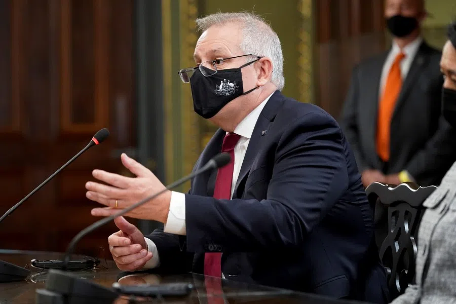 Australian Prime Minister Scott Morrison speaks as he meets with US Vice President Kamala Harris and Japanese Prime Minister Yoshihide Suga in the vice president's ceremonial office of the Eisenhower Executive Office Building at the White House campus in Washington, US, 24 September 2021. (Patrick Semansky/Pool via Reuters)