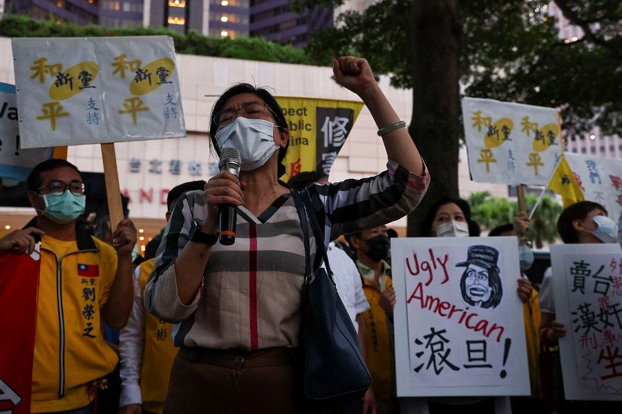 Demonstrators take part in a protest against US House Speaker Nancy Pelosi's visit, in Taipei, Taiwan, 2 August 2022. (Ann Wang/Reuters)