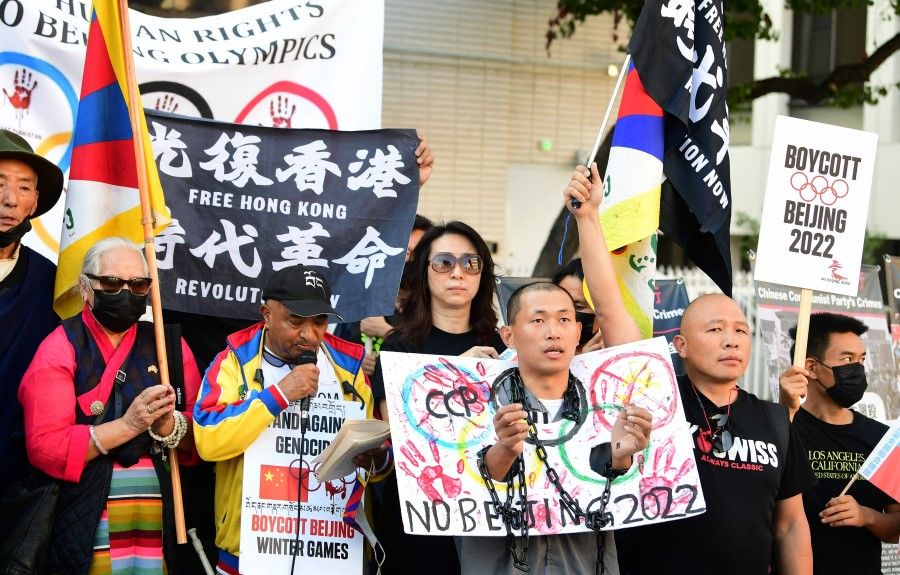 Activists rally in front of the Chinese Consulate in Los Angeles, California on 3 November 2021, calling for a boycott of the 2022 Beijing Winter Olympics due to concerns over China's human rights record. (Frederic J. Brown/AFP)