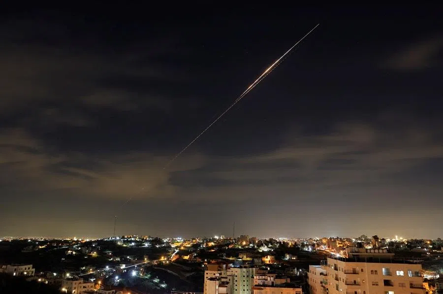 Iranian missiles fly towards Israel, amid the US-Israeli conflict with Iran, as seen from Hebron, in the Israeli-occupied West Bank, on 23 March 2026. (Mussa Qawasma/Reuters)