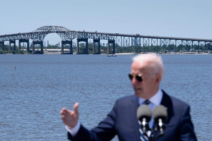 US President Joe Biden speaks about infrastructure and jobs along the banks of the Calcasieu River near Interstate 10 on 6 May 2021, in Westlake, Louisiana. (Brendan Smialowski/AFP)
