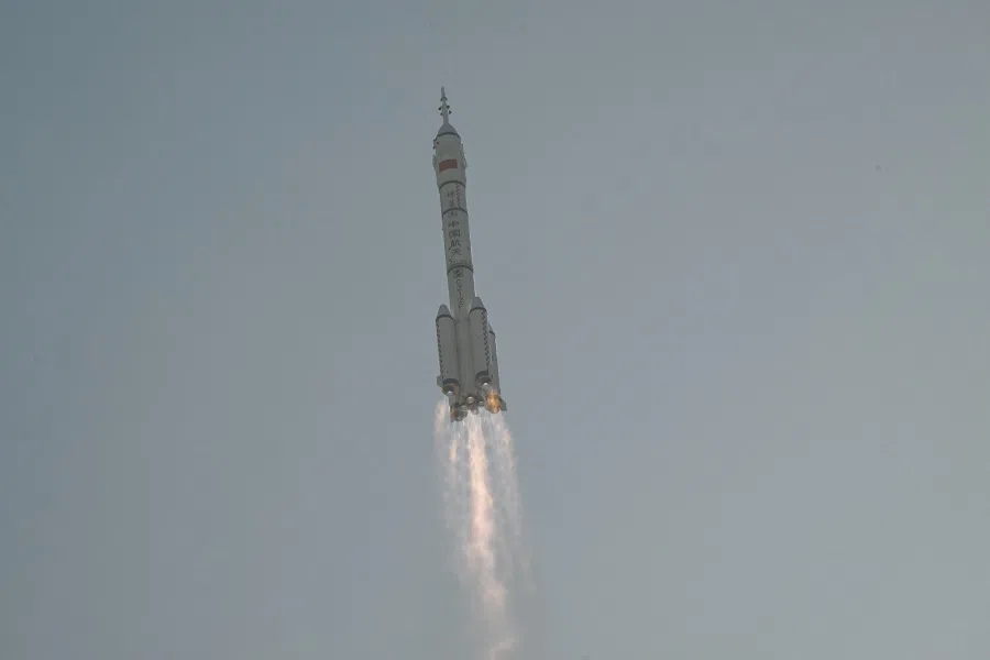 The Long March-2F carrier rocket lifts off from the Jiuquan Satellite Launch Centre in the Gobi desert, in northwest China on 26 October 2023. (Pedro Pardo/AFP)