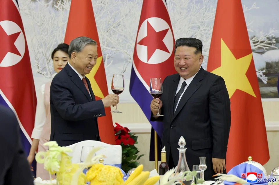 This picture taken on 9 October 2025 and released by North Korea's official Korean Central News Agency (KCNA) on 10 October 2025 shows North Korean leader Kim Jong Un (right) and Vietnam’s Communist Party General Secretary To Lam (left) attending a welcome banquet at the headquarters of the Central Committee of the Workers’ Party of Korea in Pyongyang. (KCNA via KNS/AFP)