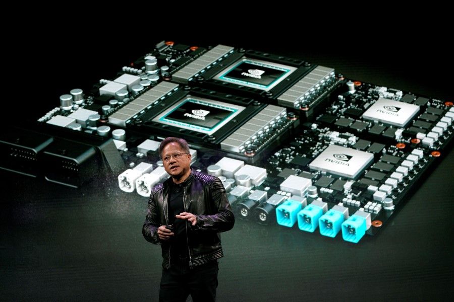 Jensen Huang, CEO of Nvidia, shows the Drive Pegasus robotaxi AI computer at his keynote address at CES in Las Vegas, Nevada, 7 January 2018. (Rick Wilking/REUTERS)