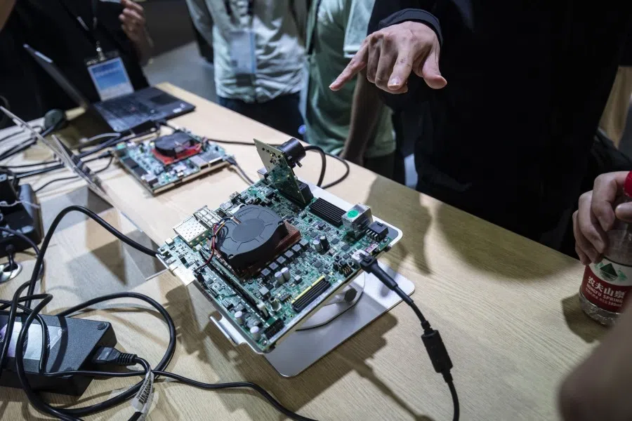Attendees look at products at the Advanced Micro Devices Inc. (AMD) booth at the MWC Shanghai event in Shanghai, China, on 28 une 2023. (Qilai Shen/Bloomberg)