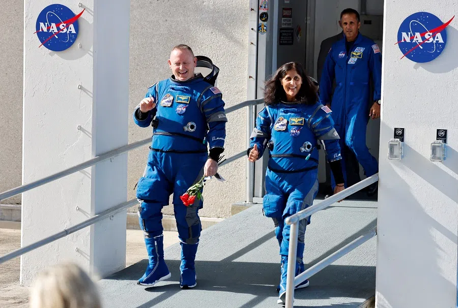 NASA astronauts Butch Wilmore and Suni Williams walk at NASA’s Kennedy Space Center, on the day of Boeing’s Starliner-1 Crew Flight Test (CFT) mission on a United Launch Alliance Atlas V rocket to the International Space Station, in Cape Canaveral, Florida, US, on 1 June 2024.  (Joe Skipper/Reuters)