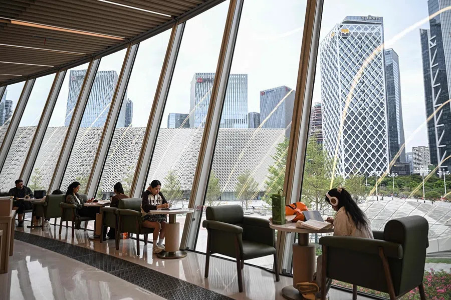 People read books at a bookstore in Shenzhen, in southern China's Guangdong province on 21 October 2025. (Jade Gao/AFP)