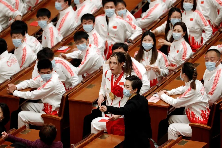 Freestyle skier Gu Ailing Eileen at the Great Hall of the People before a meeting commending role models of the Beijing 2022 Olympic and Paralympic Winter Games, in Beijing, China, 8 April 2022. (Florence Lo/Reuters)
